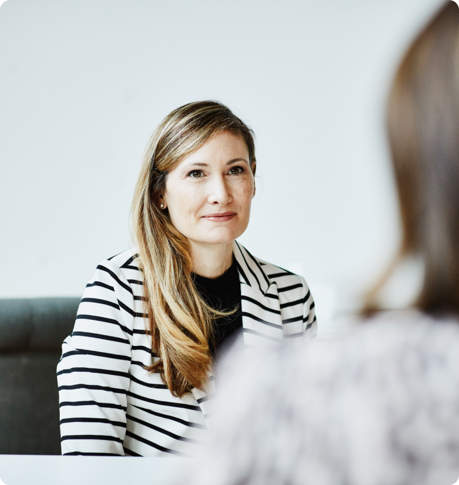 Image of female healthcare professional discussing HealthEdge's Care Management Workflow.