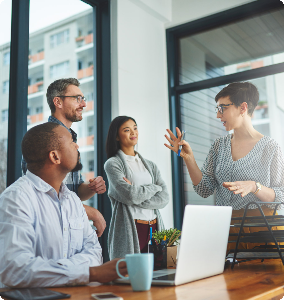 Image shows diverse healthcare professionals gathered around computer screen