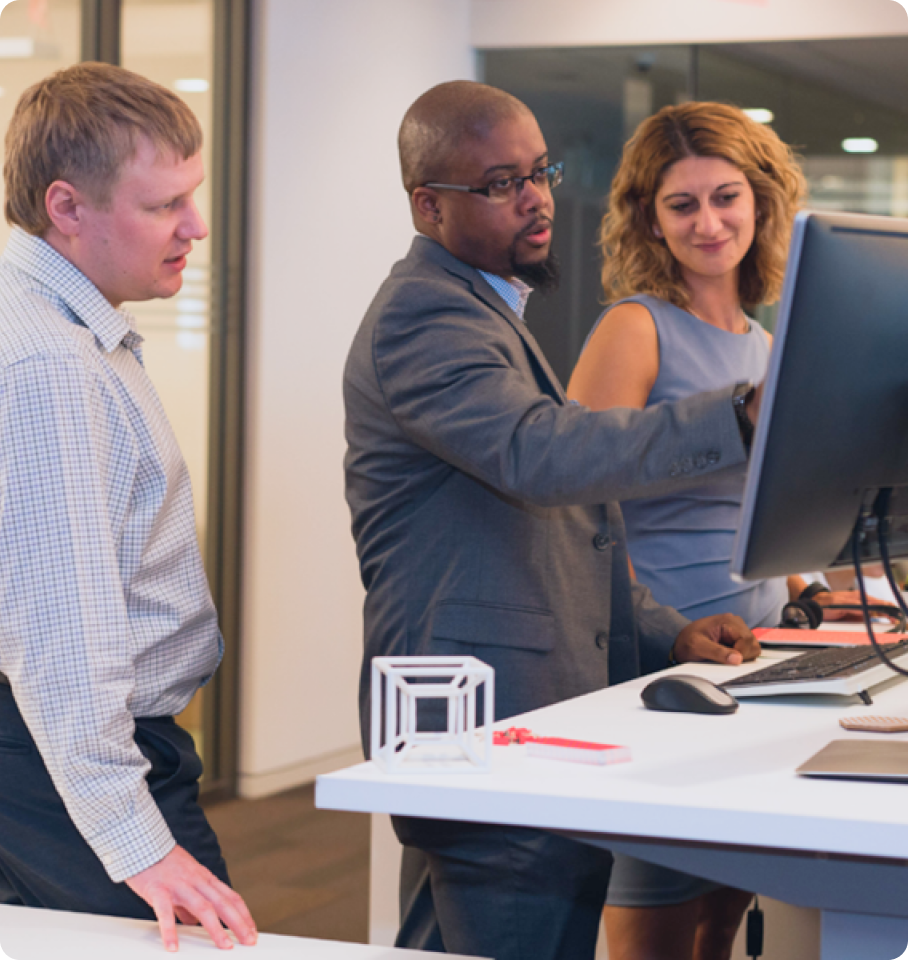 Group of diverse healthcare professionals collaborating in a modern office space, symbolizing a culture of belonging and teamwork in the healthcare industry.